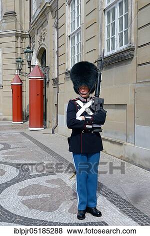 Stock Photo - Guard at Amalienborg Castle, seat of government of the Danish Royal Family, Copenhagen, Denmark, Europe. Fotosearch