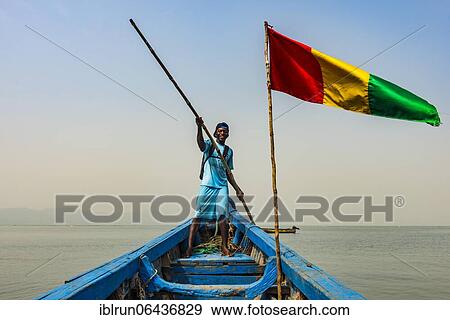 Guinean flag on a boat, Conakry, Republic of Guinea, Guinea Conakry View Large Photo Image Stock Photo - Guinean flag on a boat, Conakry, Republic of Guinea, Guinea Conakry. Fotosearch