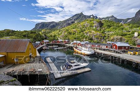 Stock Image - Harbour with fishing boat, Rorbu cabins, historic fishing village Nusfjord, Lofoten, Nordland, Norway, Europe. Fotosearch