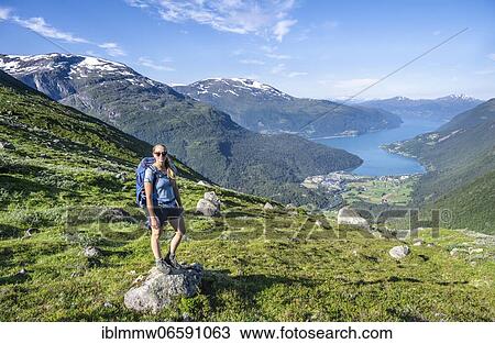 Hiker on the trail to Skåla mountain, Innvikfjorden fjord, Jostedalsbreen National Park, Stryn, Vestland, Norway, Europe View Large Photo Image Stock Image - Hiker on the trail to Skåla mountain, Innvikfjorden fjord, Jostedalsbreen National Park, Stryn, Vestland, Norway, Europe. Fotosearch