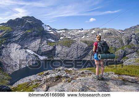 Hiking in front of lake Fjerddalsvatnet, hiking to Munkebu cabin, mountains, near Sørvågen, Moskenesøya, Lofoten, Nordland View Large Photo Image Stock Photo - Hiking in front of lake Fjerddalsvatnet, hiking to Munkebu cabin, mountains, near Sørvågen, Moskenesøya, Lofoten, Nordland. Fotosearch