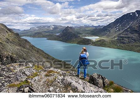 Hiking on the Besseggen Hike, ridge walk, Lake Gjende, Jotunheimen National Park, Vågå, Innlandet, Norway, Europe View Large Photo Image Picture - Hiking on the Besseggen Hike, ridge walk, Lake Gjende, Jotunheimen National Park, Vågå, Innlandet, Norway, Europe. Fotosearch