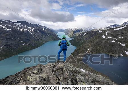 Stock Image - Hiking on the Besseggen Hike, ridge walk, right lake Bessvatnet, left lake Gjende, Jotunheimen National Park, Vågå, Innlandet, Norway, Europe. Fotosearch