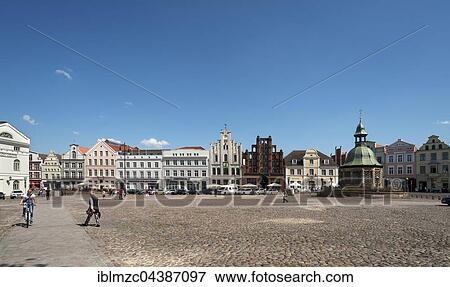 Stock Photo - Historic buildings on the market square, Wismar Wasserkunst, Mecklenburg-Western Pomerania, Germany, Europe. Fotosearch