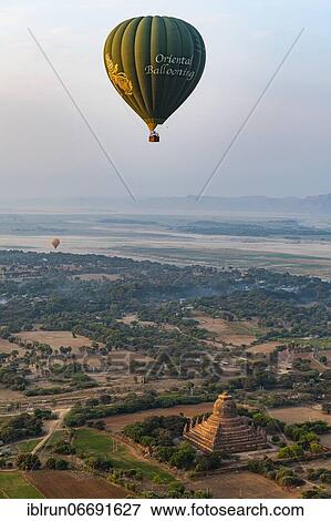 Hot air balloon at sunrise over temples of Bagan, Myanmar, Asia View Large Photo Image Stock Photo - Hot air balloon at sunrise over temples of Bagan, Myanmar, Asia. Fotosearch