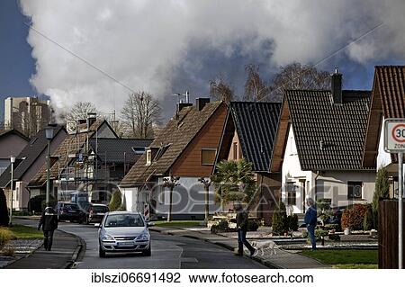 Housing estate in front of the RWE Weisweiler power plant, Inden, North Rhine-Westphalia, Germany, Europe View Large Photo Image Stock Image - Housing estate in front of the RWE Weisweiler power plant, Inden, North Rhine-Westphalia, Germany, Europe. Fotosearch