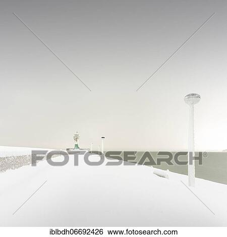 Iced quay wall and lighthouse in the harbour of Sassnitz on the island of Rügen, Mecklenburg-Western Pomerania, Germany, Europe View Large Photo Image Stock Photograph - Iced quay wall and lighthouse in the harbour of Sassnitz on the island of Rügen, Mecklenburg-Western Pomerania, Germany, Europe. Fotosearch