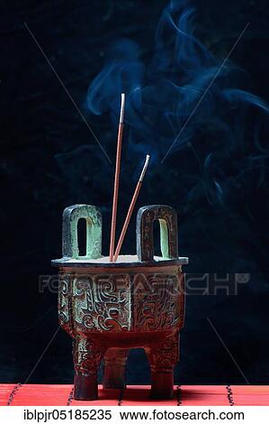 Incense burner with burning incense sticks View Large Photo Image Stock Photography - Incense burner with burning incense sticks. Fotosearch