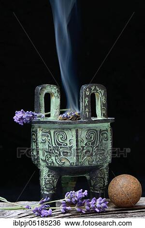 Stock Photograph - Incense burner with lavender. Fotosearch