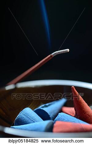 Incense cones in bowl and burning incense sticks, incense candle View Large Photo Image Stock Photography - Incense cones in bowl and burning incense sticks, incense candle. Fotosearch