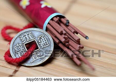 Incense sticks and lucky coin, lucky coin View Large Photo Image Stock Image - Incense sticks and lucky coin, lucky coin. Fotosearch
