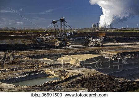 Stock Image - Inden opencast mine with Weisweiler power plant, opencast lignite mine, Inden, Rhenish lignite mining region, North Rhine-Westphalia, Germany, Europe. Fotosearch