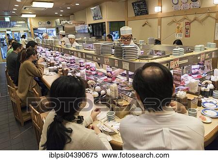 Kaiten-zushi restaurant serving sushi on rotating conveyor belt, Kyoto, Japan, Asia View Large Photo Image Stock Photography - Kaiten-zushi restaurant serving sushi on rotating conveyor belt, Kyoto, Japan, Asia. Fotosearch