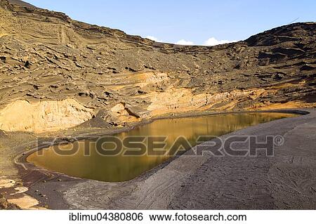Lago Verde, green lagoon, black sand beach, El Golfo, Lanzarote, Canary Islands, Spain, Europe View Large Photo Image Stock Photograph - Lago Verde, green lagoon, black sand beach, El Golfo, Lanzarote, Canary Islands, Spain, Europe. Fotosearch