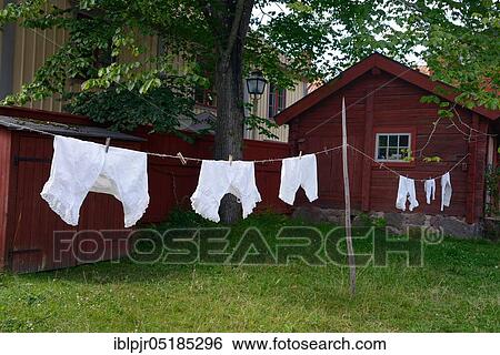 Laundry on a line, hung up to dry, farming village, Linköping Open Air Museum, Sweden, Europe View Large Photo Image Stock Photograph - Laundry on a line, hung up to dry, farming village, Linköping Open Air Museum, Sweden, Europe. Fotosearch