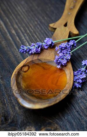Lavender honey and lavender flowers, lavender honey( Lavandula spec. ), bee honey View Large Photo Image Stock Image - Lavender honey and lavender flowers, lavender honey( Lavandula spec. ), bee honey. Fotosearch