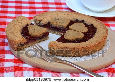 Linzertorte on wooden board, Linzer-Torte View Large Photo Image Stock Photography - Linzertorte on wooden board, Linzer-Torte. Fotosearch