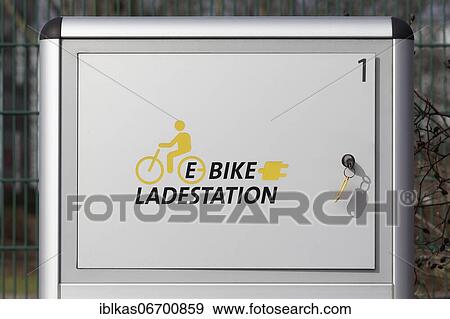 Stock Photo - Lockable e-bike charging station, pictogram and lettering, Düsseldorf, North Rhine-Westphalia, Germany, Europe. Fotosearch