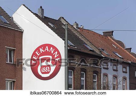 Picture - Logo Teapot 1882 on house facade, tea bag producer, Düsseldorf, North Rhine-Westphalia, Germany, Europe. Fotosearch