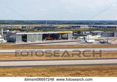 Stock Photo - Lufthansa Technik Hangar Aircraft Berlin Brandenburg Airport BER aerial view in Berlin, Germany, Europe. Fotosearch