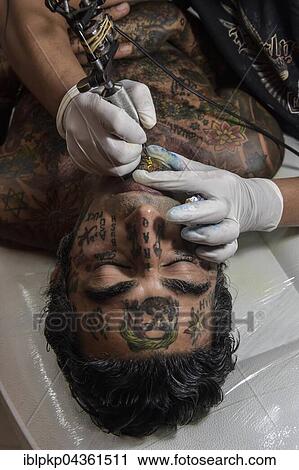 Man, Arab gets tattooed on his chin, Ko Samui, Thailand, Asia View Large Photo Image Stock Image - Man, Arab gets tattooed on his chin, Ko Samui, Thailand, Asia. Fotosearch