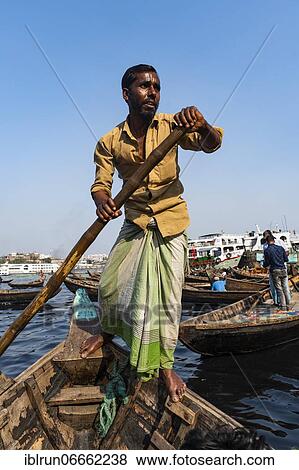Stock Photo - Man rowing his boat, Port of Dhaka, Bangladesh, Asia. Fotosearch