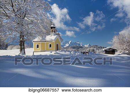 Stock Photo - Maria Rast Chapel on the Buckelwiesen with Zugspitze Group in the Wetterstein Mountains, Krün, Werdenfelser Land, Upper Bavaria, Bavaria, Germany, Europe. Fotosearch