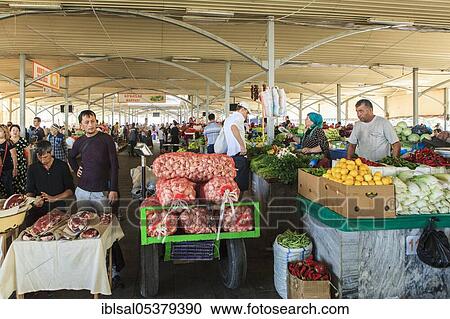 Stock Image - Market stand with vegetables and meat, bazaar in Tashkent, Uzbekistan, Asia. Fotosearch