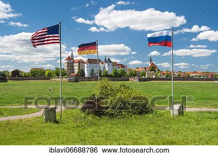 Stock Photograph - Memorial The Spirit of the Elbe commemorating the first meeting of Soviet and US troops on April 25, 1945 near the end of World War II, behind Hartenfels Castle on the Elbe River, Torgau, Saxony, Germany, Europe. Fotosearch