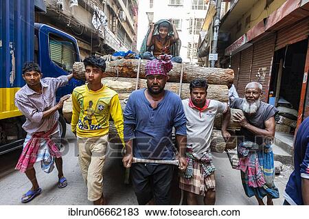 Men carrying a huge load through the bazaar, Dhaka, Bangladesh, Asia View Large Photo Image Stock Image - Men carrying a huge load through the bazaar, Dhaka, Bangladesh, Asia. Fotosearch