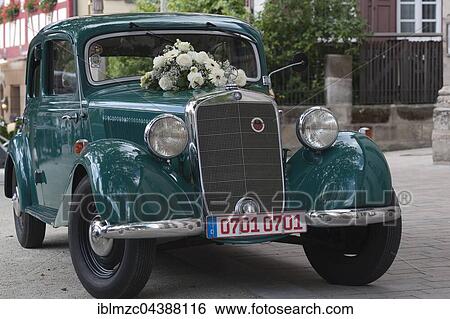 Mercedes old-timer, wedding car decorated with white roses, Bavaria, Germany, Europe View Large Photo Image Stock Photograph - Mercedes old-timer, wedding car decorated with white roses, Bavaria, Germany, Europe. Fotosearch