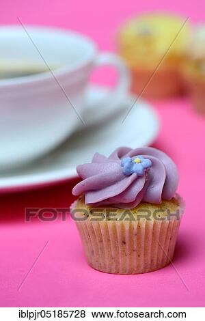 Stock Photo - Mini cupcake and coffee cup. Fotosearch