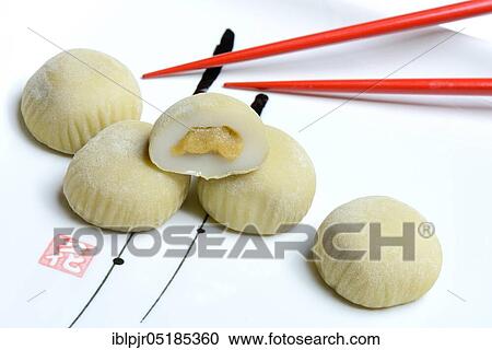 Mochi with chopsticks, Japanese sticky rice cake with green tea taste, Asian confectionery speciality View Large Photo Image Stock Image - Mochi with chopsticks, Japanese sticky rice cake with green tea taste, Asian confectionery speciality. Fotosearch