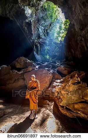 Monk standing in Saddan cave, Hpa-An, Kayin state, Myanmar, Asia View Large Photo Image Stock Photo - Monk standing in Saddan cave, Hpa-An, Kayin state, Myanmar, Asia. Fotosearch