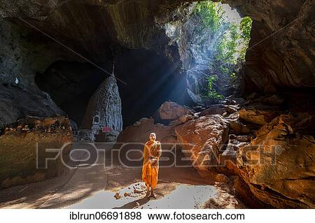 Monk standing in Saddan cave, Hpa-An, Kayin state, Myanmar, Asia View Large Photo Image Stock Photo - Monk standing in Saddan cave, Hpa-An, Kayin state, Myanmar, Asia. Fotosearch