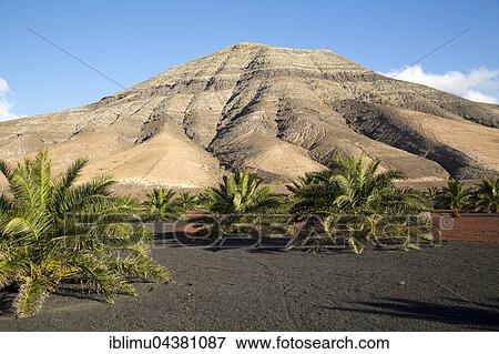 Stock Photo - Montana de Medio, mountain in volcanic landscape, Los Ajaches mountain range, Lanzarote, Canary Islands, Spain, Europe. Fotosearch
