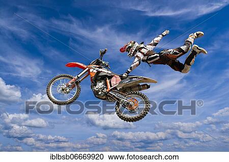 Motocross motorcycle and rider in the air, doing a stunt, Biberach, Baden-Württemberg, Germany, Europe View Large Photo Image Stock Image - Motocross motorcycle and rider in the air, doing a stunt, Biberach, Baden-Württemberg, Germany, Europe. Fotosearch
