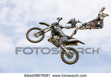 Motocross rider jumping in front of cloudy sky, Biberach, Baden-Württemberg, Germany, Europe View Large Photo Image Stock Image - Motocross rider jumping in front of cloudy sky, Biberach, Baden-Württemberg, Germany, Europe. Fotosearch