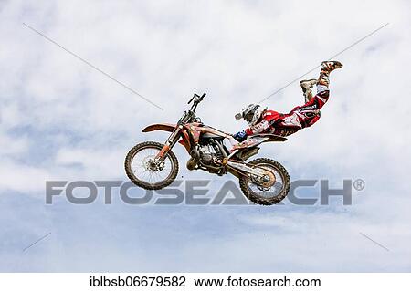 Motocross rider jumping in front of cloudy sky, Biberach, Baden-Württemberg, Germany, Europe View Large Photo Image Stock Image - Motocross rider jumping in front of cloudy sky, Biberach, Baden-Württemberg, Germany, Europe. Fotosearch