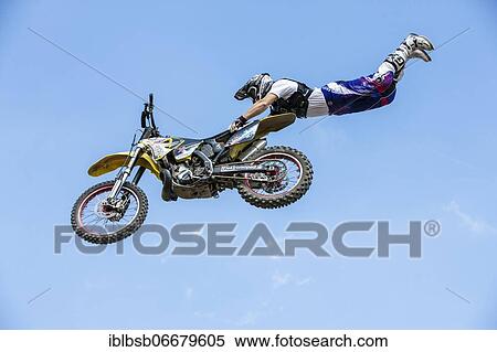 Motocross rider jumping in front of blue sky, Biberach, Baden-Württemberg, Germany, Europe View Large Photo Image Stock Photography - Motocross rider jumping in front of blue sky, Biberach, Baden-Württemberg, Germany, Europe. Fotosearch