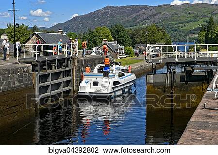 Motorboat passing through lock in Caledonian Canal, Loch Ness inflow, Fort Augustus, Scotland, UK View Large Photo Image Stock Image - Motorboat passing through lock in Caledonian Canal, Loch Ness inflow, Fort Augustus, Scotland, UK. Fotosearch