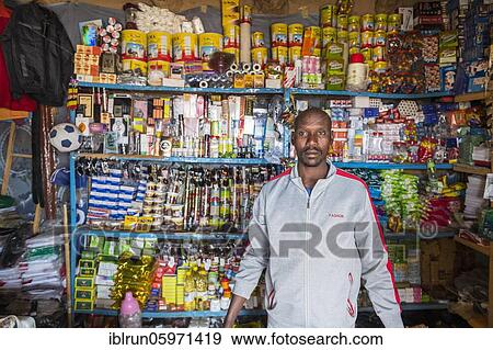 Stock Photo - Nab in his little shop in a village at Ounianga kebir part of the the Unesco sight Ounianga lakes, northern Chad, Africa. Fotosearch