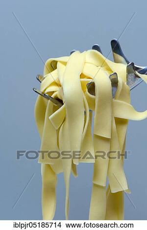 Noodles, cooked, pappardelle, tagliatelle, pasta, ribbon noodles View Large Photo Image Picture - Noodles, cooked, pappardelle, tagliatelle, pasta, ribbon noodles. Fotosearch