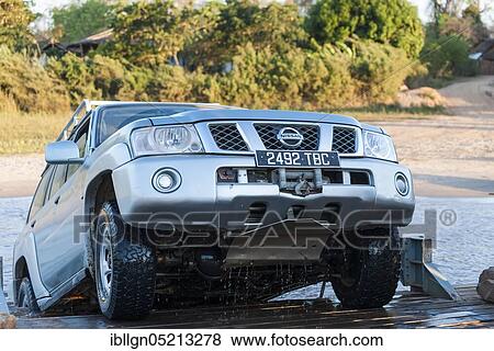 Off-road vehicle rides on ferry across the Manambolo, Bekopaka, Madagascar, Africa View Large Photo Image Stock Photo - Off-road vehicle rides on ferry across the Manambolo, Bekopaka, Madagascar, Africa. Fotosearch