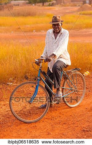 Stock Photography - Old African man, cyclist, Bobo-Dioulasso, Burkina Faso, Africa. Fotosearch