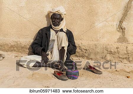 Old man before a mosque in a village at Ounianga kebir part of the the Unesco sight Ounianga lakes, northern Chad, Africa View Large Photo Image Stock Image - Old man before a mosque in a village at Ounianga kebir part of the the Unesco sight Ounianga lakes, northern Chad, Africa. Fotosearch