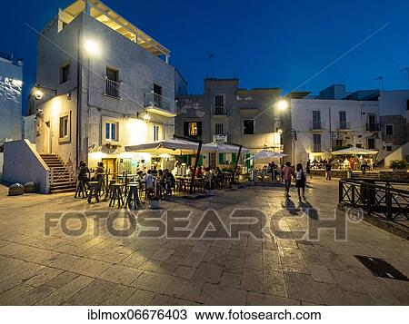Old town of Monopoli, restaurants at dusk, Puglia, Italy, Europe View Large Photo Image Stock Image - Old town of Monopoli, restaurants at dusk, Puglia, Italy, Europe. Fotosearch