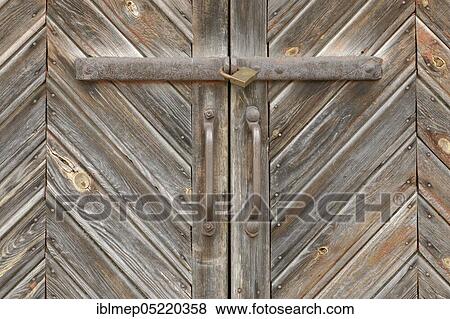 Old wooden door with lock and bolt View Large Photo Image Stock Photo - Old wooden door with lock and bolt. Fotosearch