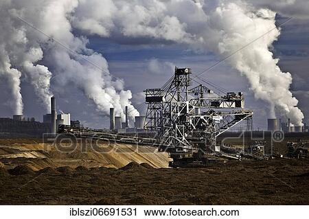 Opencast lignite mine with stacker and power plants, Garzweiler, Jüchen, Rhenish lignite mining area, North Rhine-Westphalia, Germany, Europe View Large Photo Image Stock Image - Opencast lignite mine with stacker and power plants, Garzweiler, Jüchen, Rhenish lignite mining area, North Rhine-Westphalia, Germany, Europe. Fotosearch