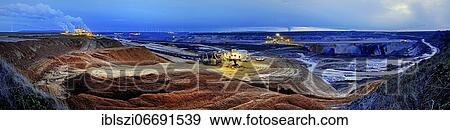 Panorama opencast lignite mine in the evening, Garzweiler, Jüchen, Rhenish lignite mining area, North Rhine-Westphalia, Germany, Europe View Large Photo Image Stock Photo - Panorama opencast lignite mine in the evening, Garzweiler, Jüchen, Rhenish lignite mining area, North Rhine-Westphalia, Germany, Europe. Fotosearch